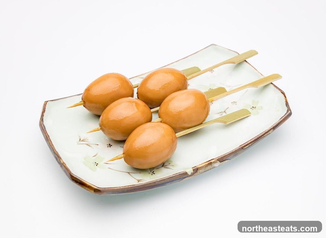 Five Skewered Braised Eggs on a Plate