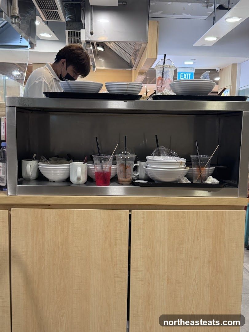 Dirty dishes and a person in a kitchen