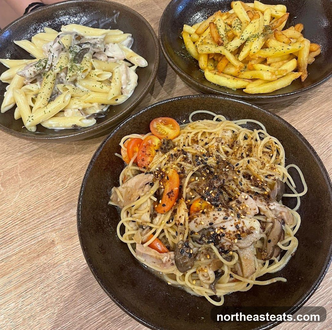 Three bowls of pasta and fries