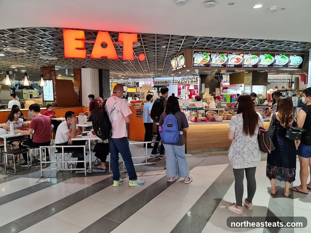 Food court with people dining and ordering