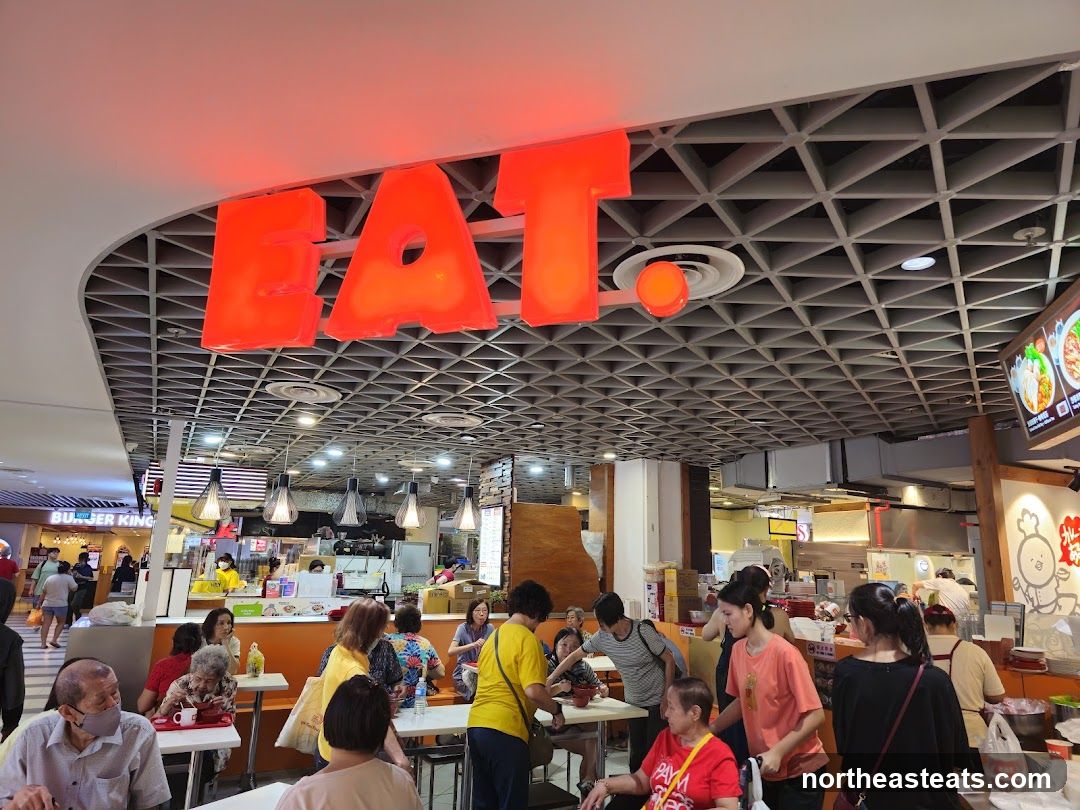 Food court with large red "EAT" sign