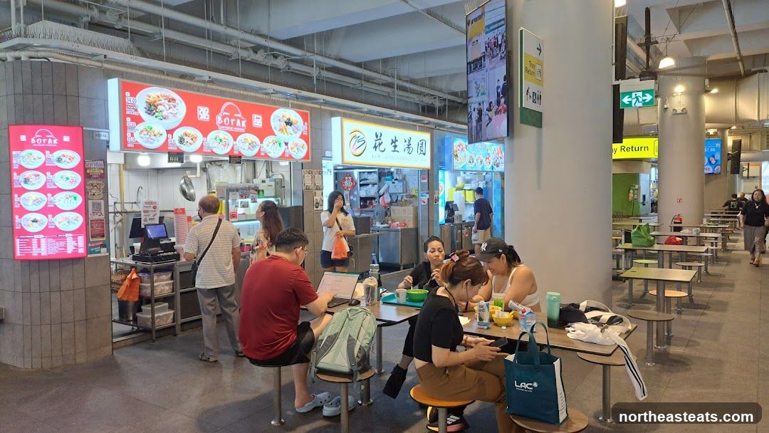 Food court with various stalls and diners