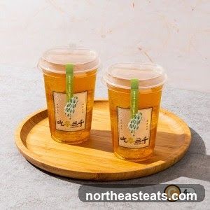 Two cups of iced tea on a wooden tray