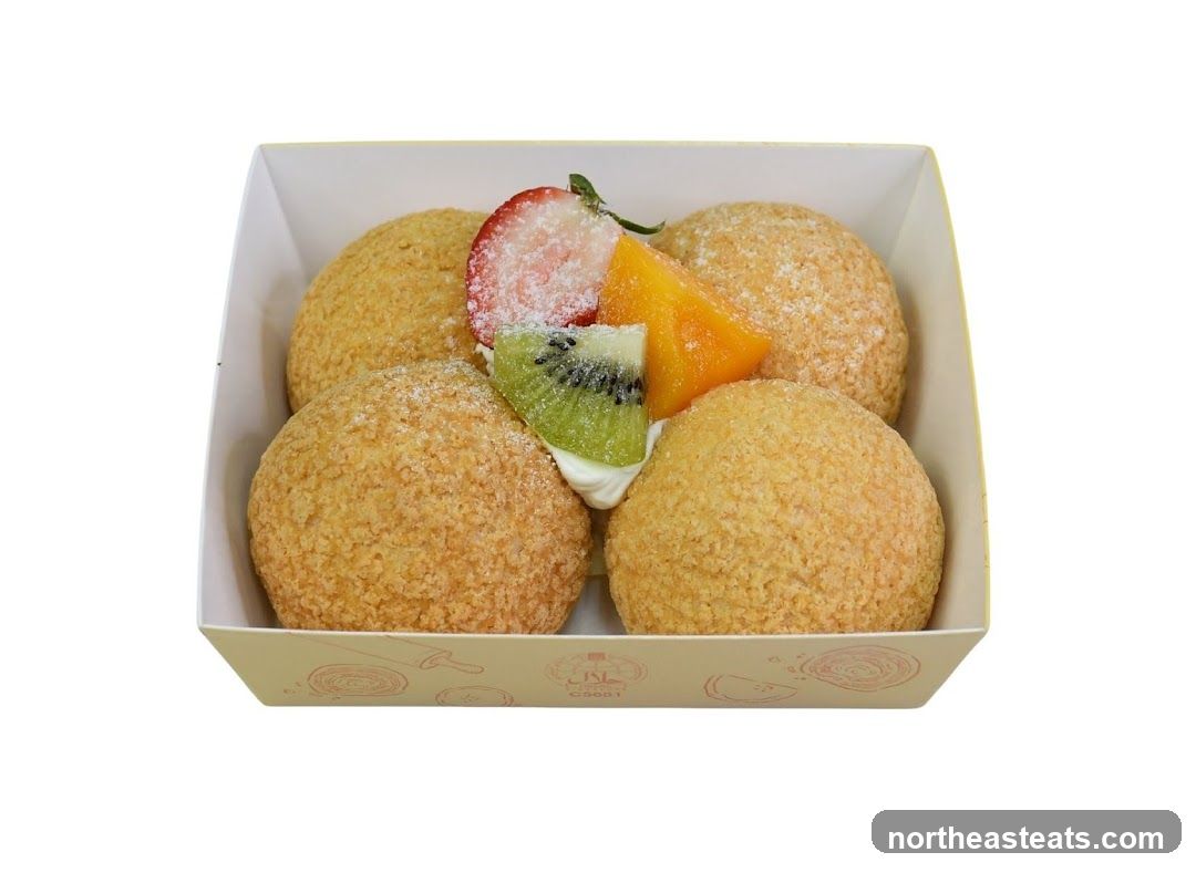 Four Cream Puffs with Fruit Topping