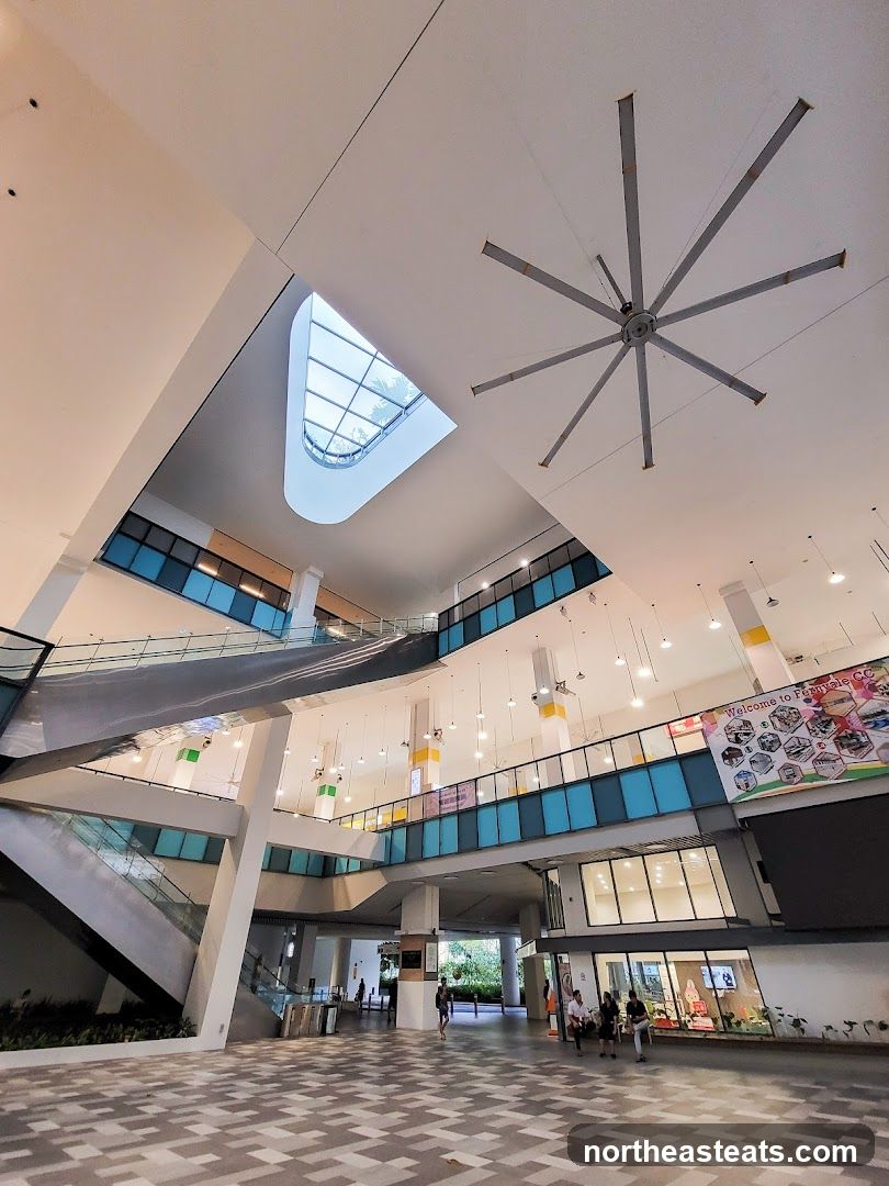 Interior of a modern building with a large fan