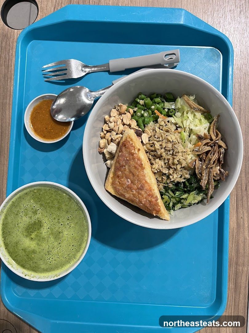Bowl of food with side dish and drink