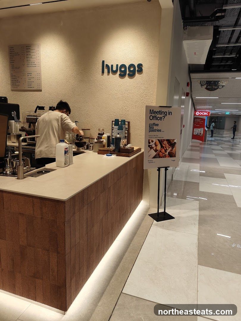 Coffee shop counter with menu and advertisement