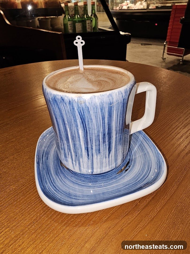Hot Beverage in a Blue and White Cup