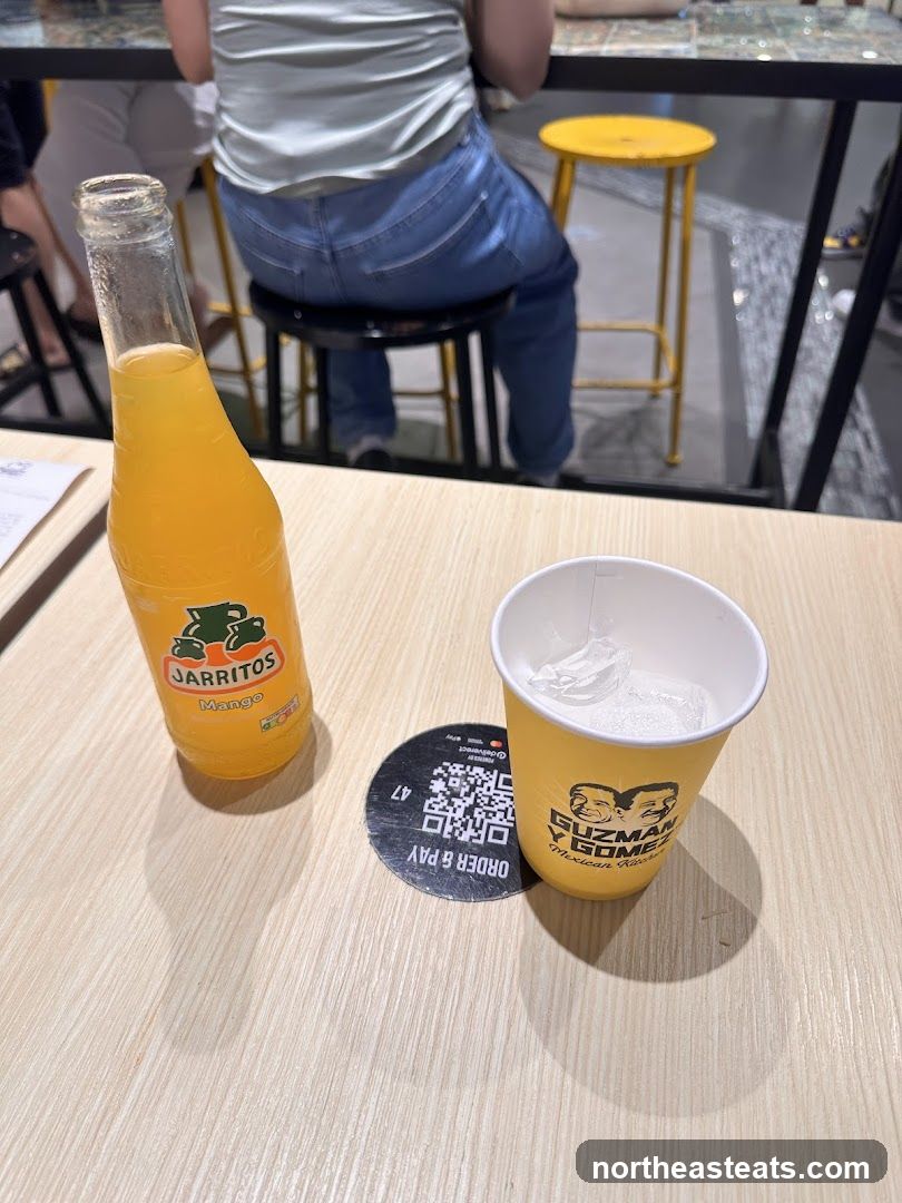 Jarritos Mango Drink and Cup with Ice