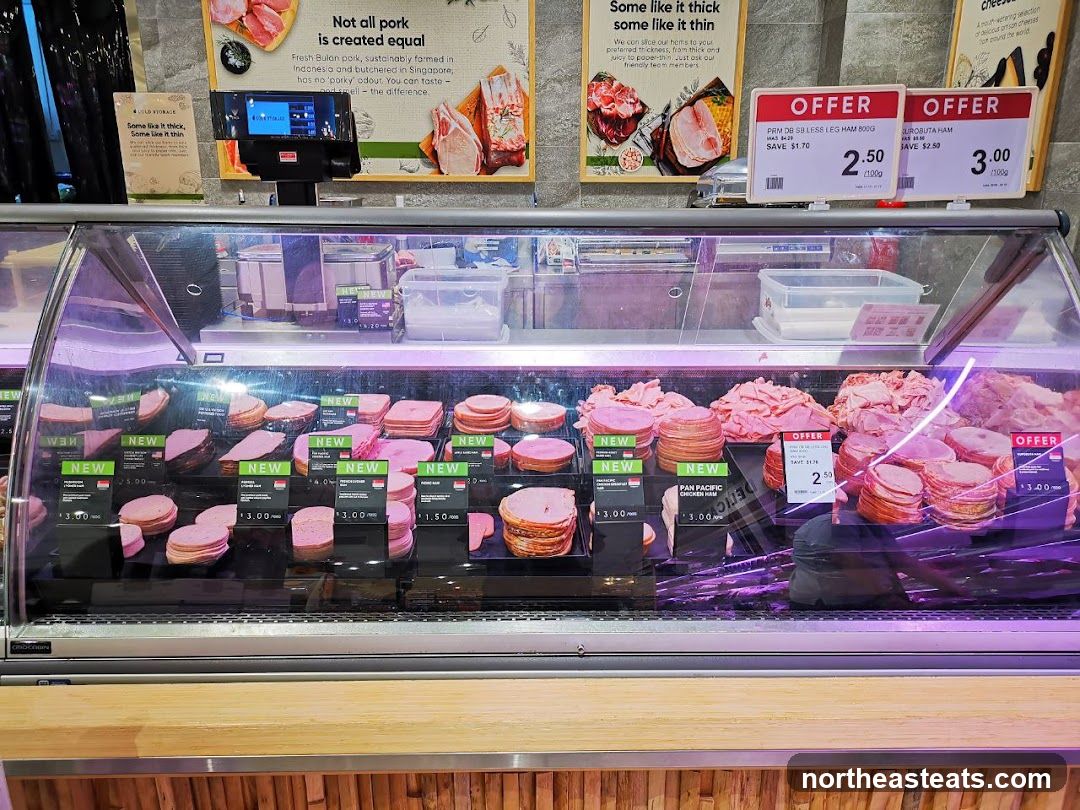 Deli counter with various sliced meats