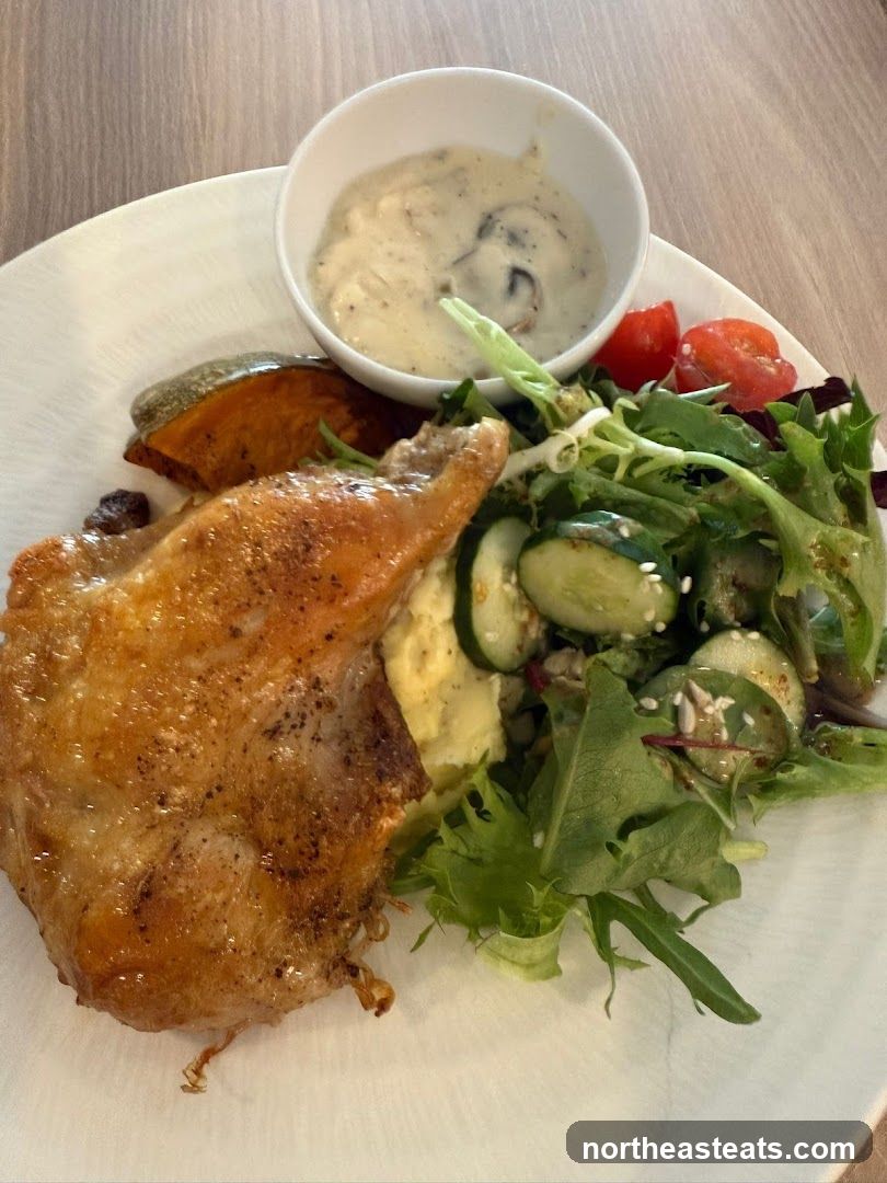 Chicken dish with salad and sauce