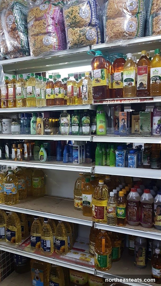 Shelves stocked with cooking oils and snacks