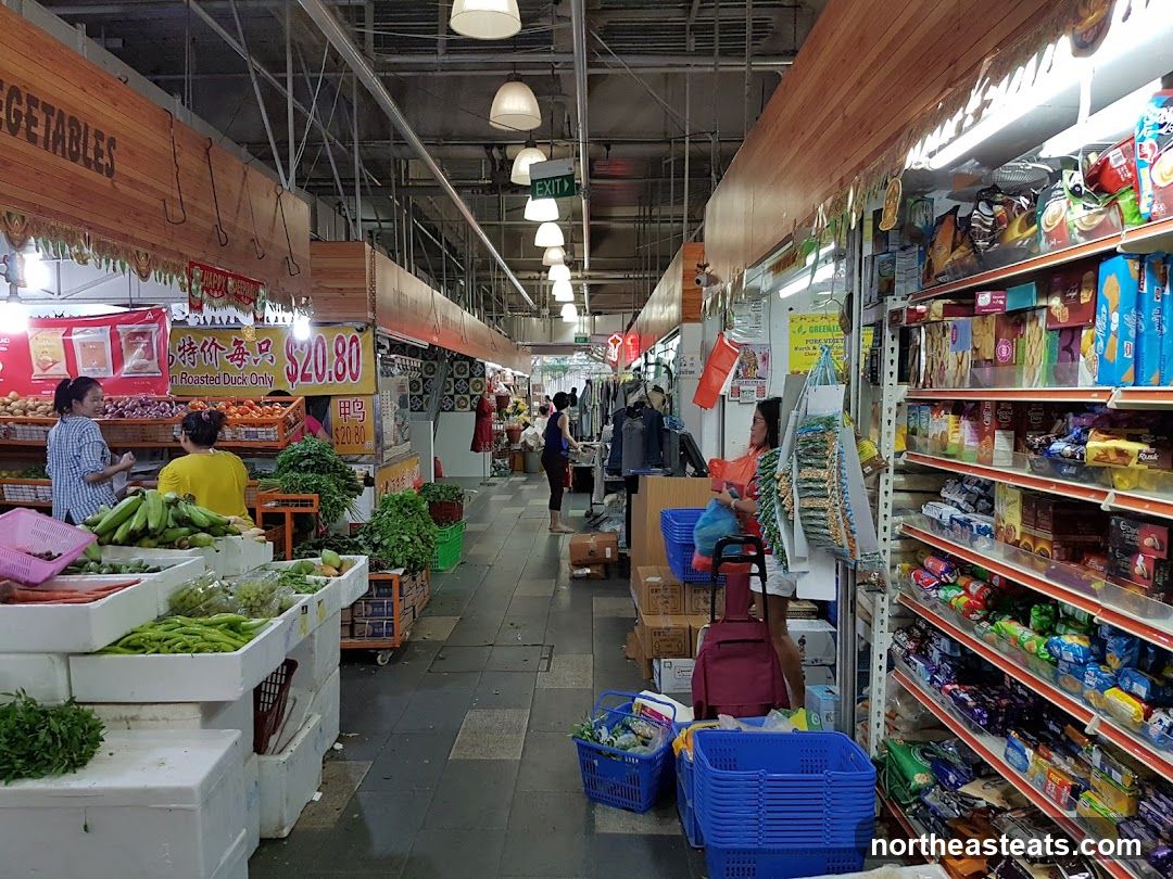 Market stalls with produce and packaged goods