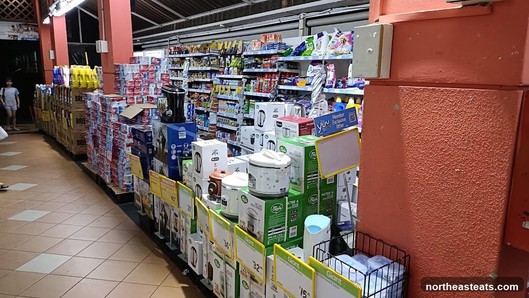 Supermarket aisle with appliances and cleaning supplies