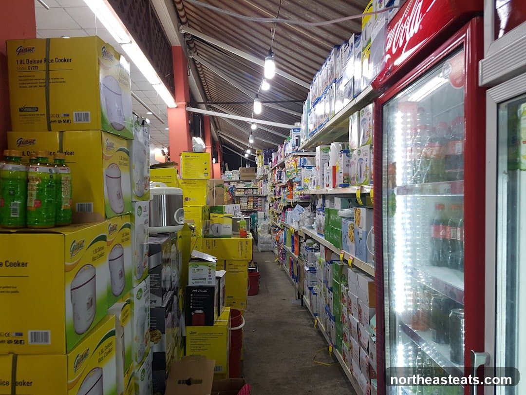 Aisle of a store with rice cookers and a refrigerator