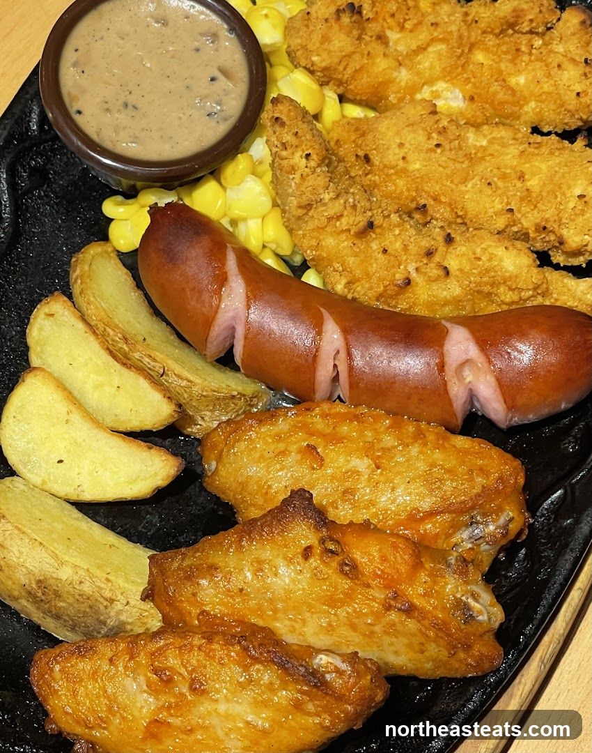 Platter with Fried Chicken, Sausage, Wings, and Sides