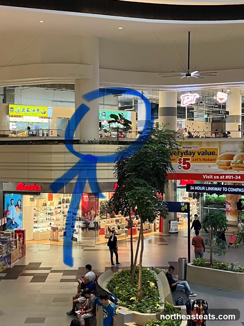 Mall Interior with Shops and Seating Area