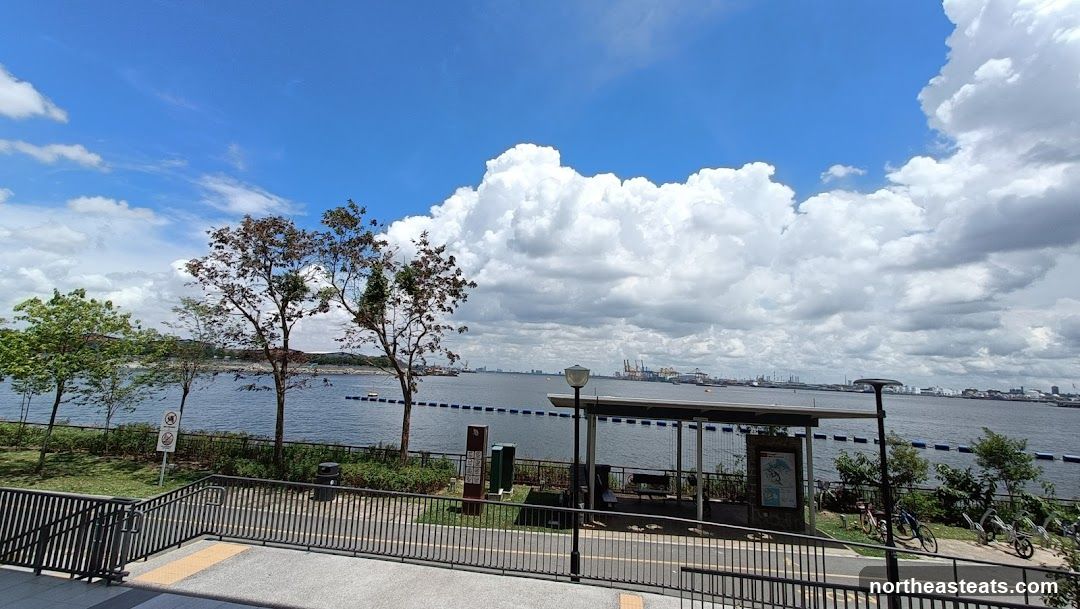 Waterfront View with Industrial Skyline