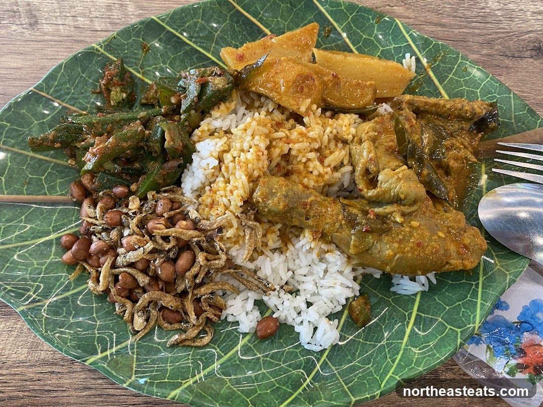 Plate of Rice with Curried Chicken and Sides