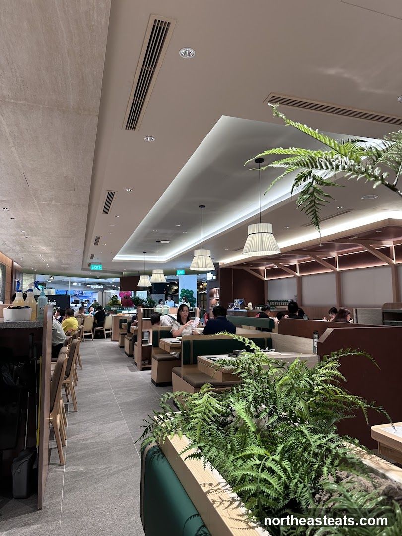 Restaurant Interior with Booth Seating and Plants
