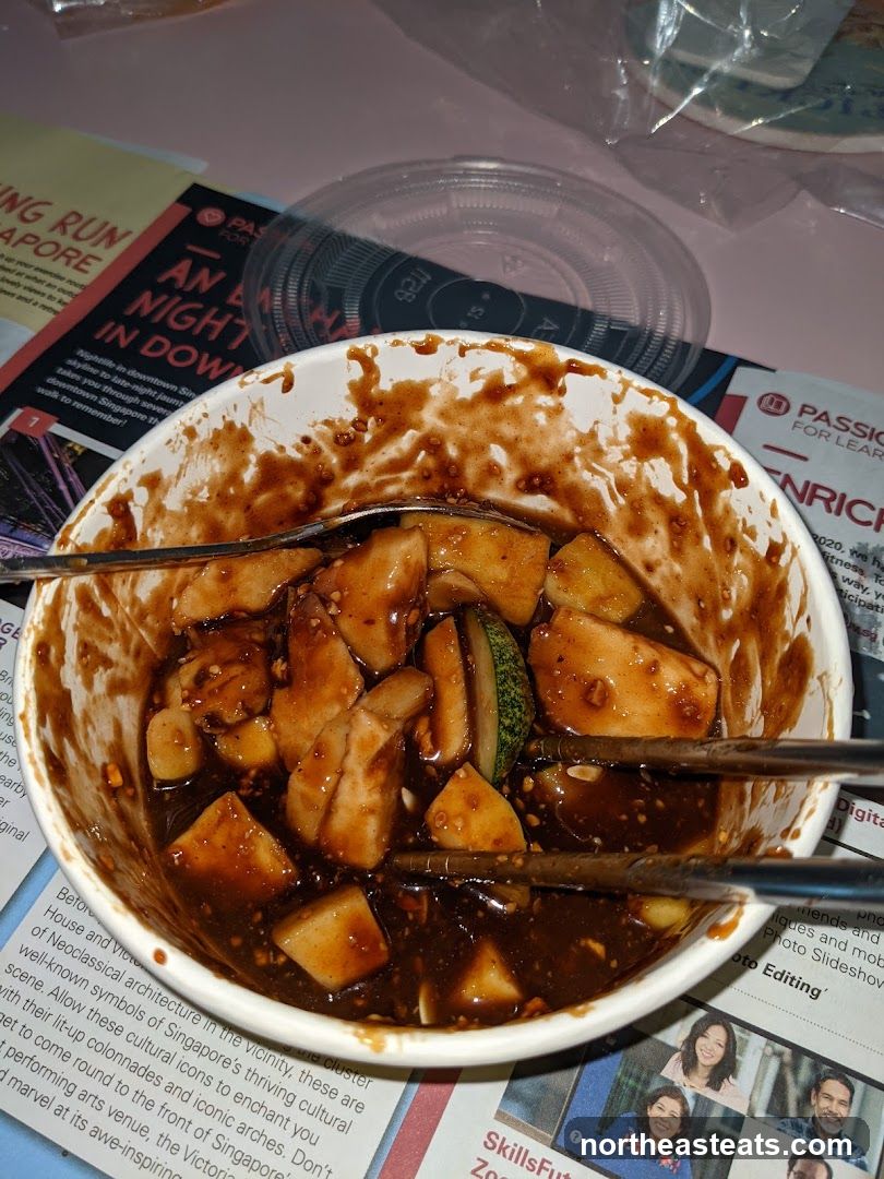 Food in a bowl with sauce