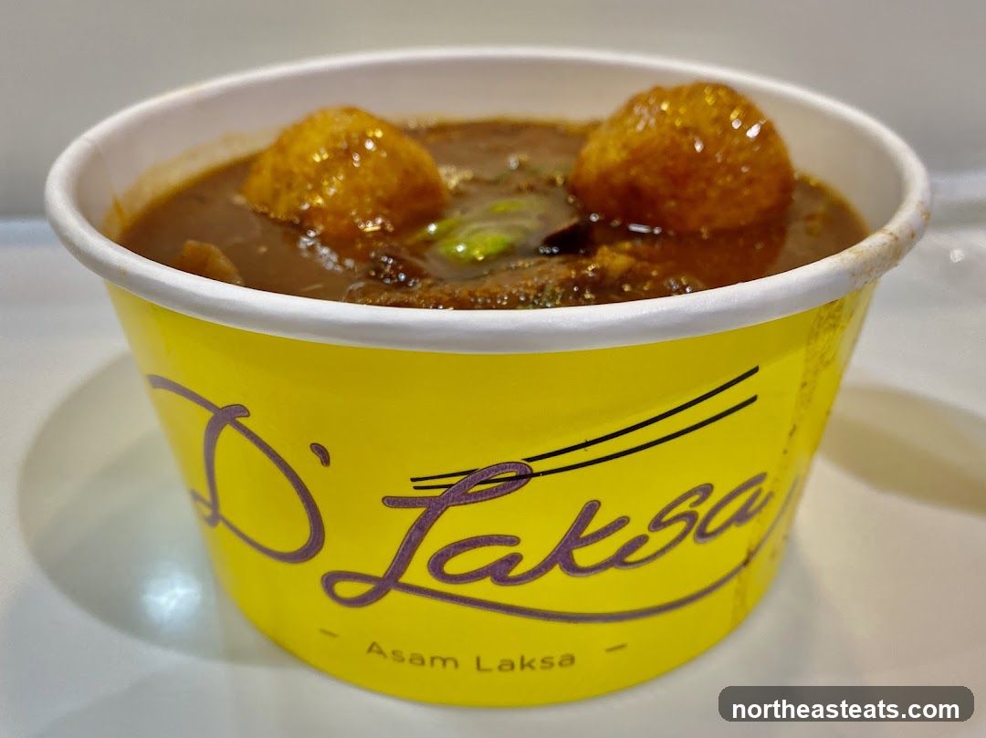Asam Laksa in a Yellow Container