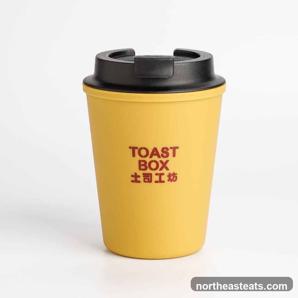 Yellow Travel Mug with "TOAST BOX" Logo