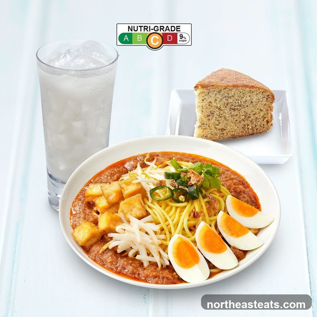 Noodle dish with drink and cake