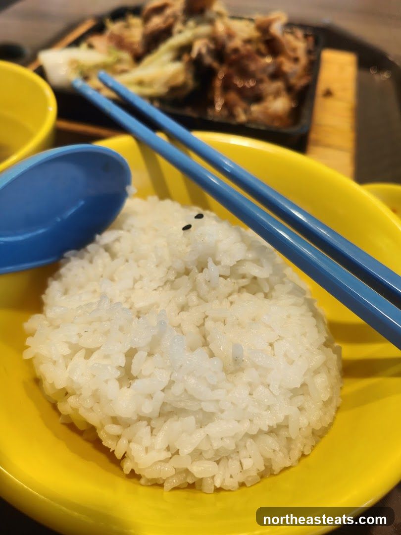 Steamed Rice with Chopsticks