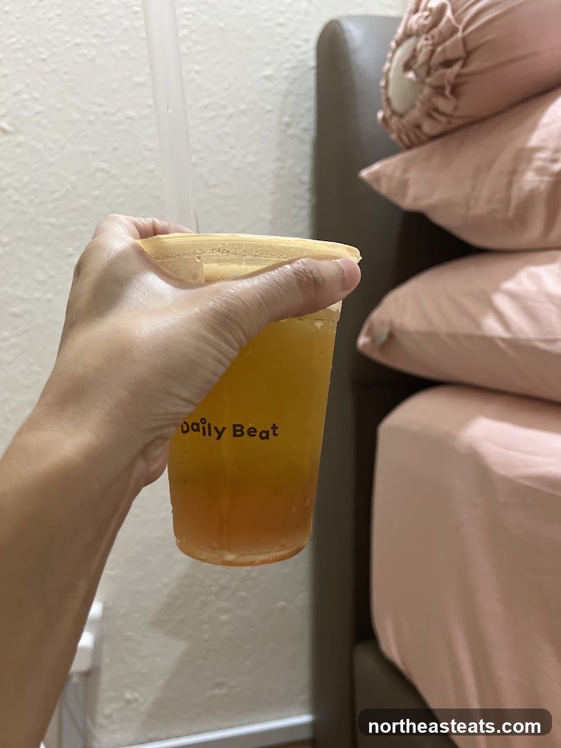 Hand holding a beverage