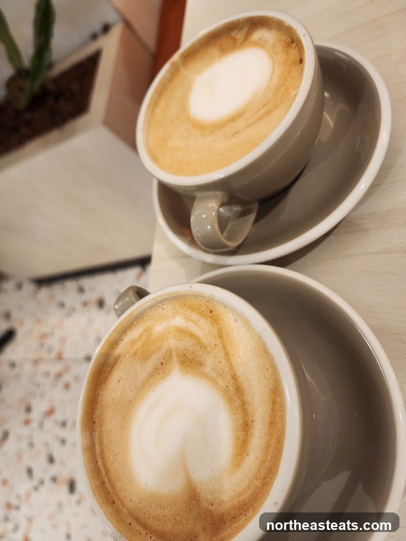 Two coffees with latte art