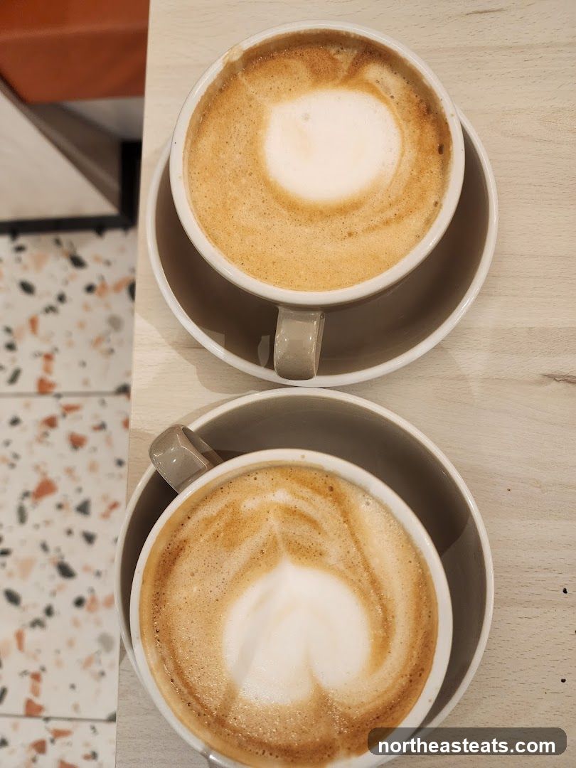 Two coffees with latte art