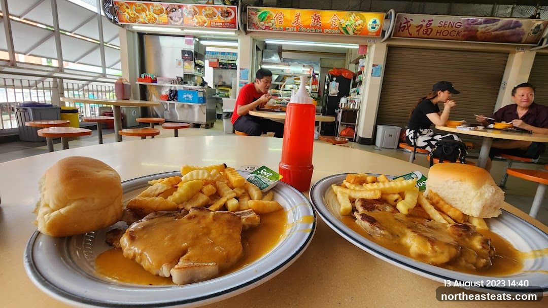 Food court dining with pork chops and fries