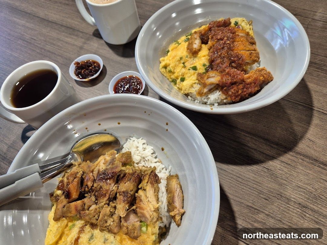 Two bowls of rice with scrambled eggs and meat