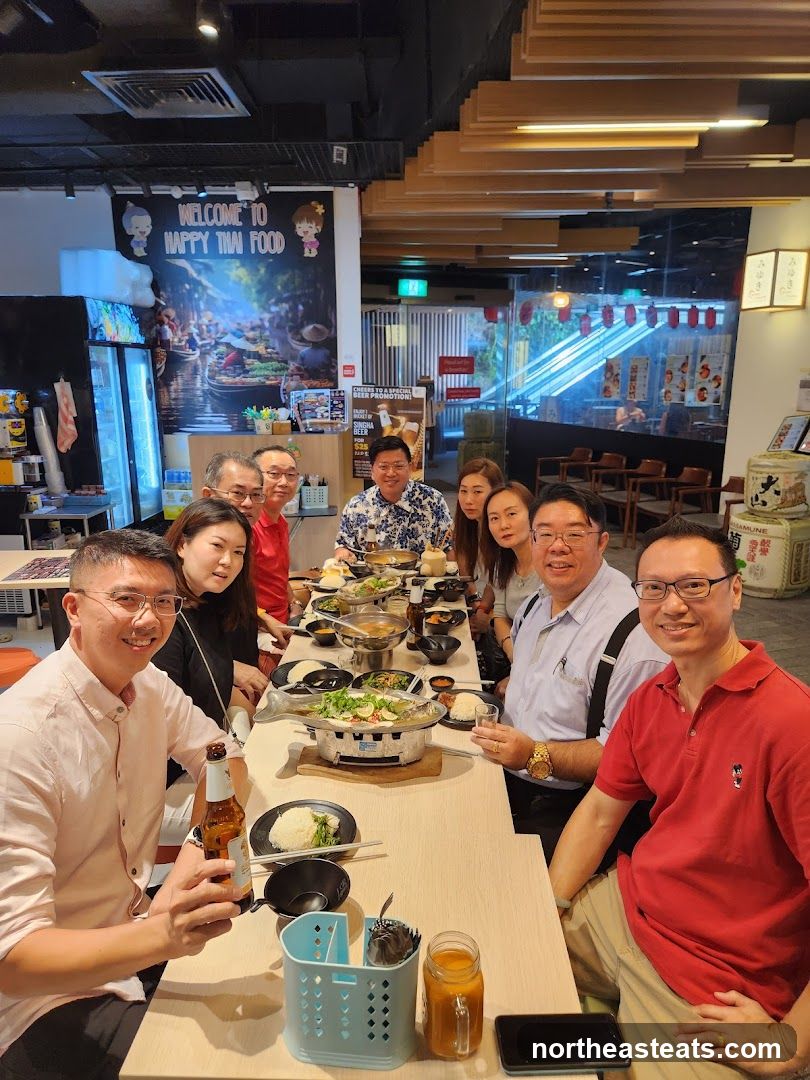 Group enjoying a meal at a Thai restaurant