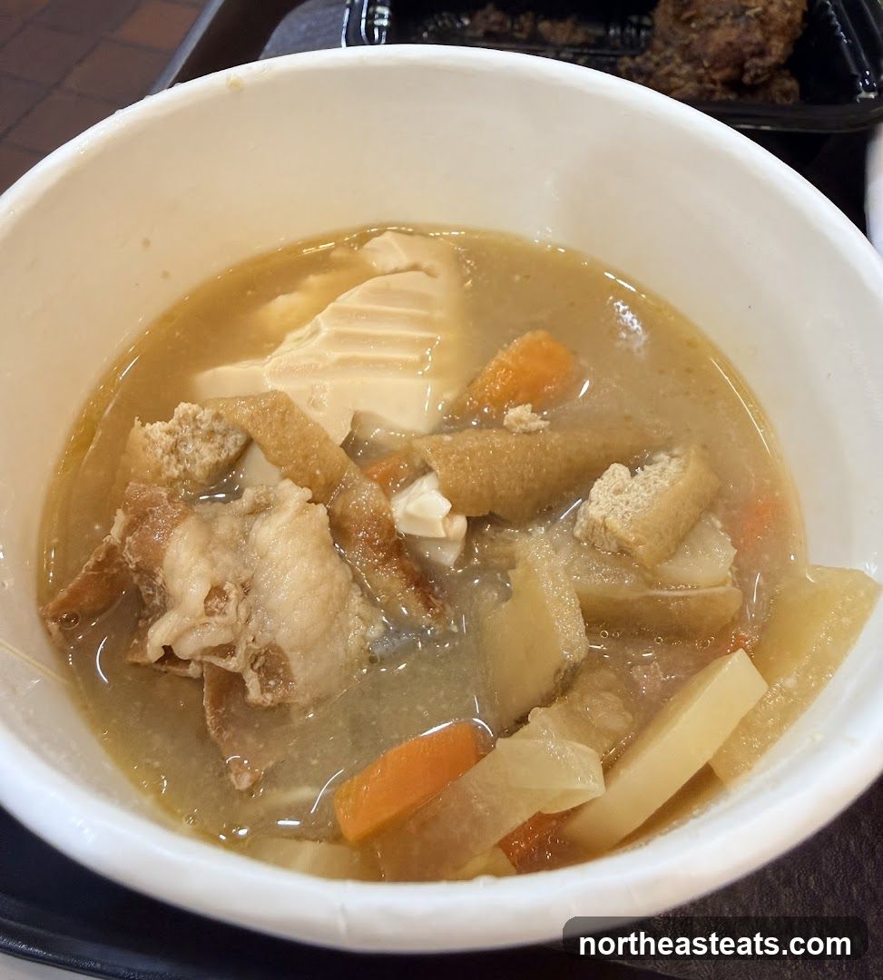 Bowl of soup with vegetables and meat