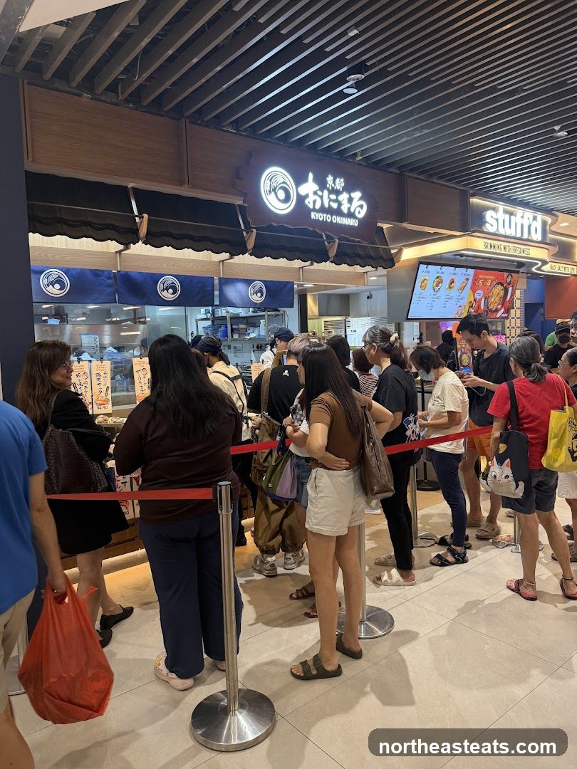 People queuing at a food stall