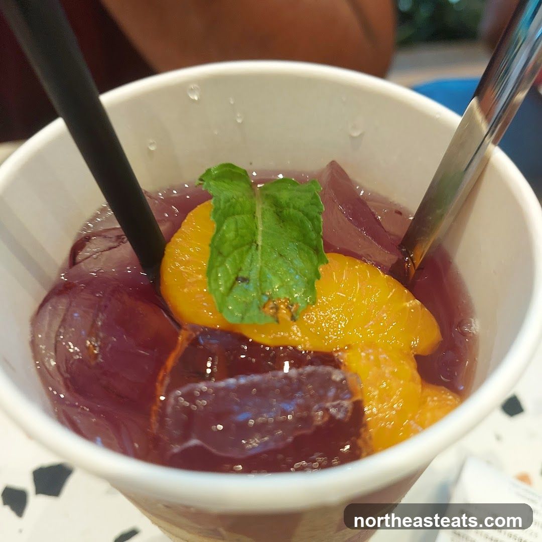 Grape Jelly Drink with Orange Slices and Mint