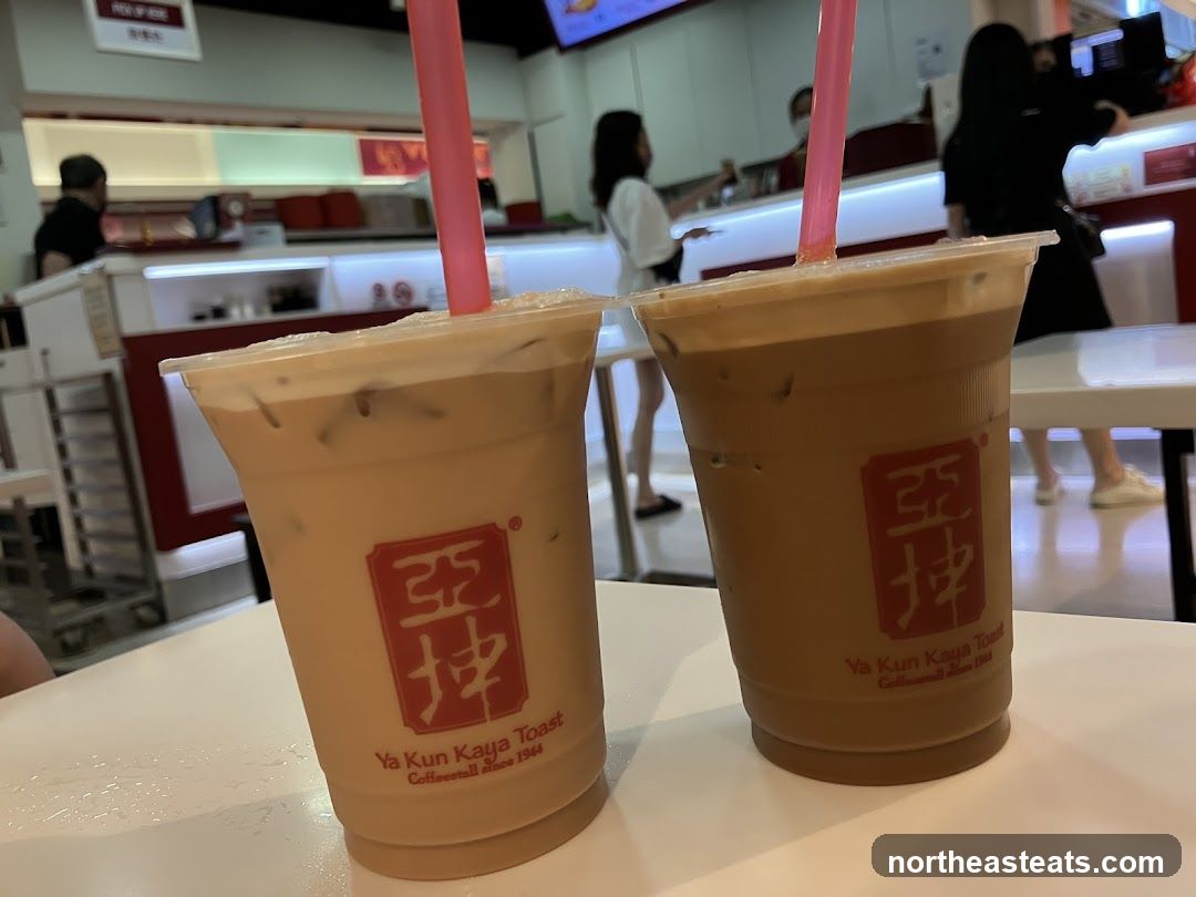 Two iced coffee drinks with Ya Kun Kaya Toast branding