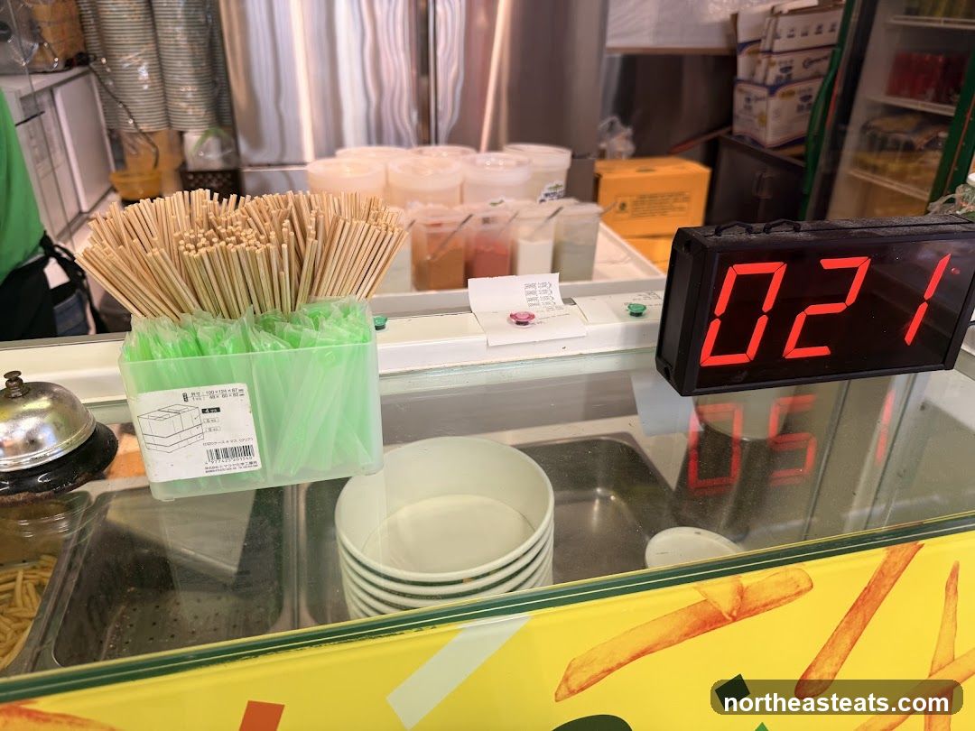 Food Service Counter with Utensils and Digital Display