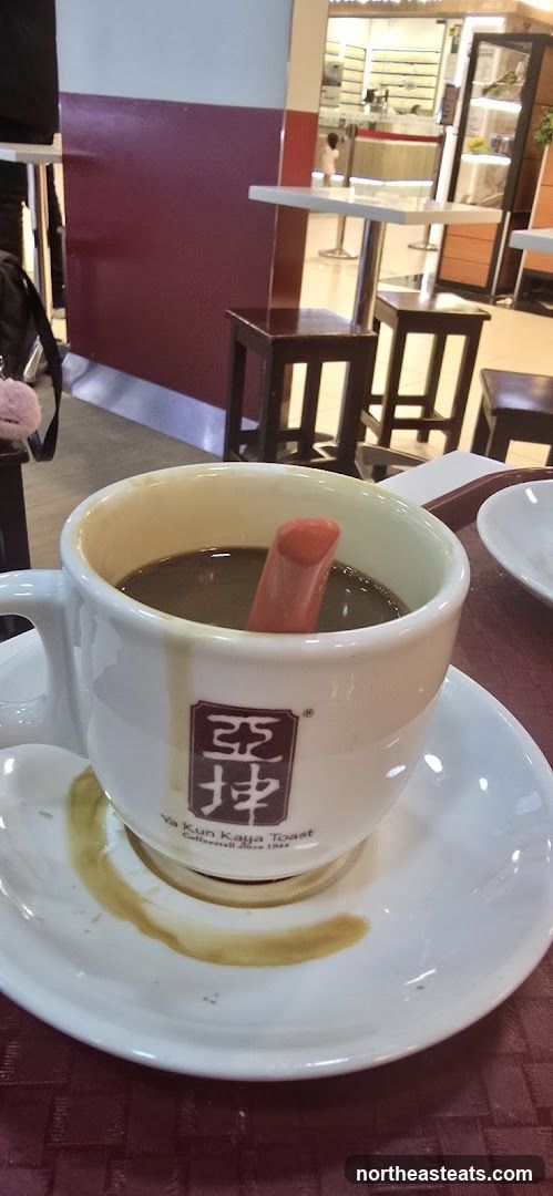 Coffee with a red stirrer