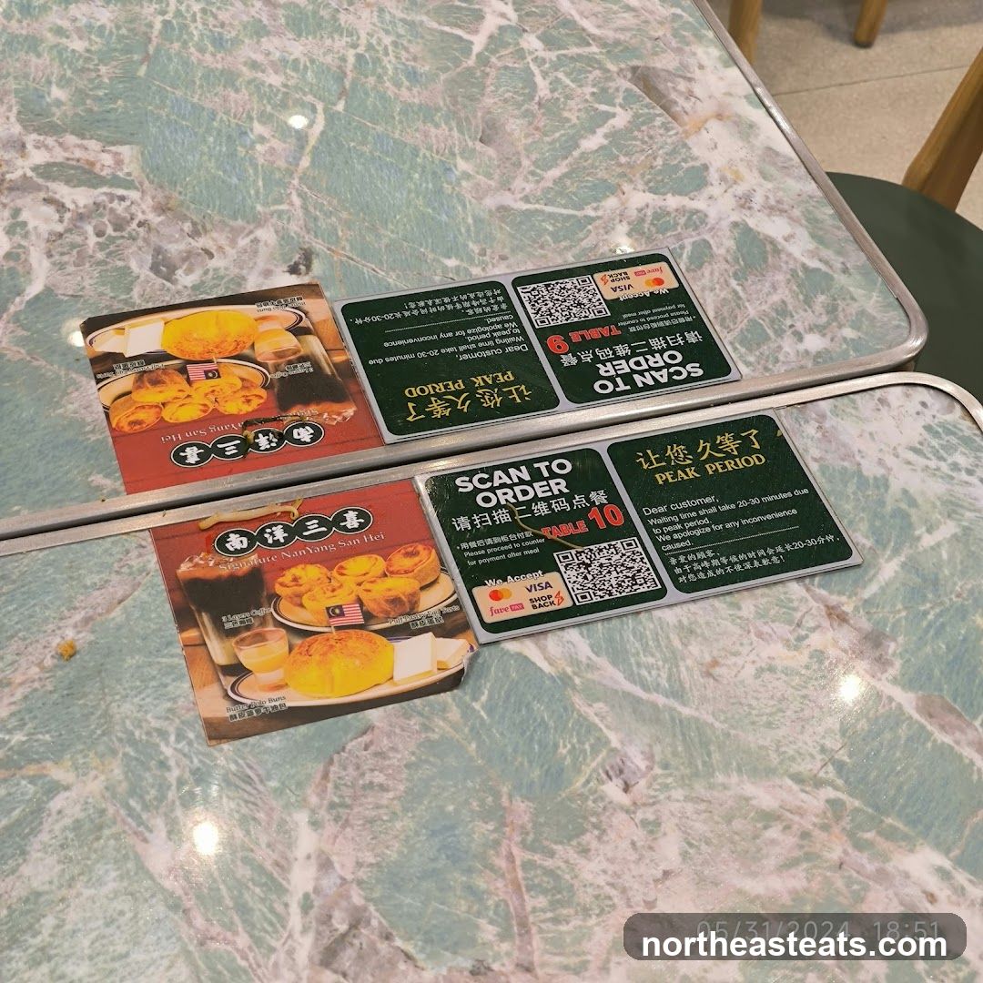 Table with QR codes and food images