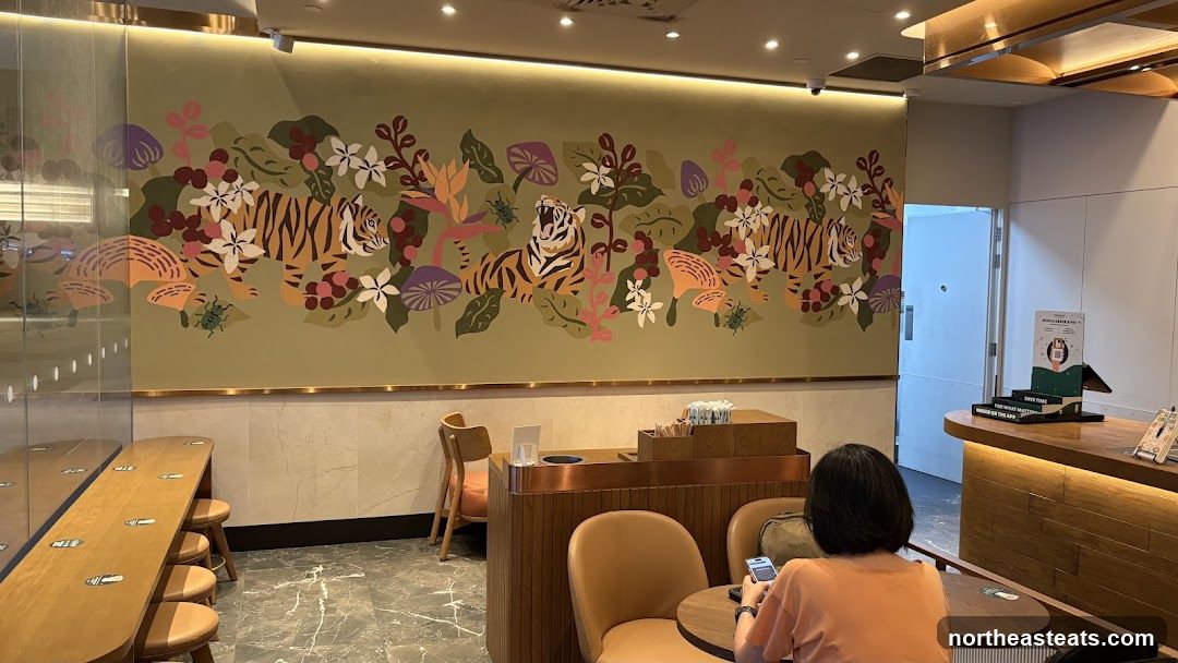 Interior of a cafe with tiger mural