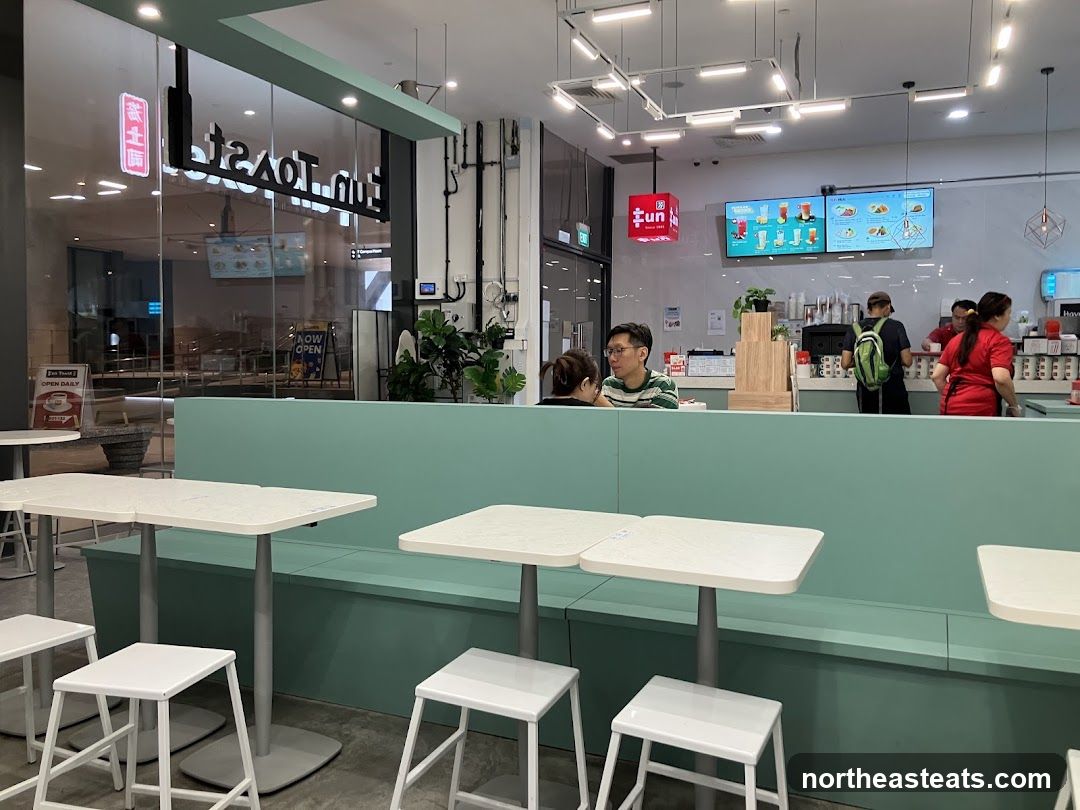 Interior of a modern cafe with seating and counter