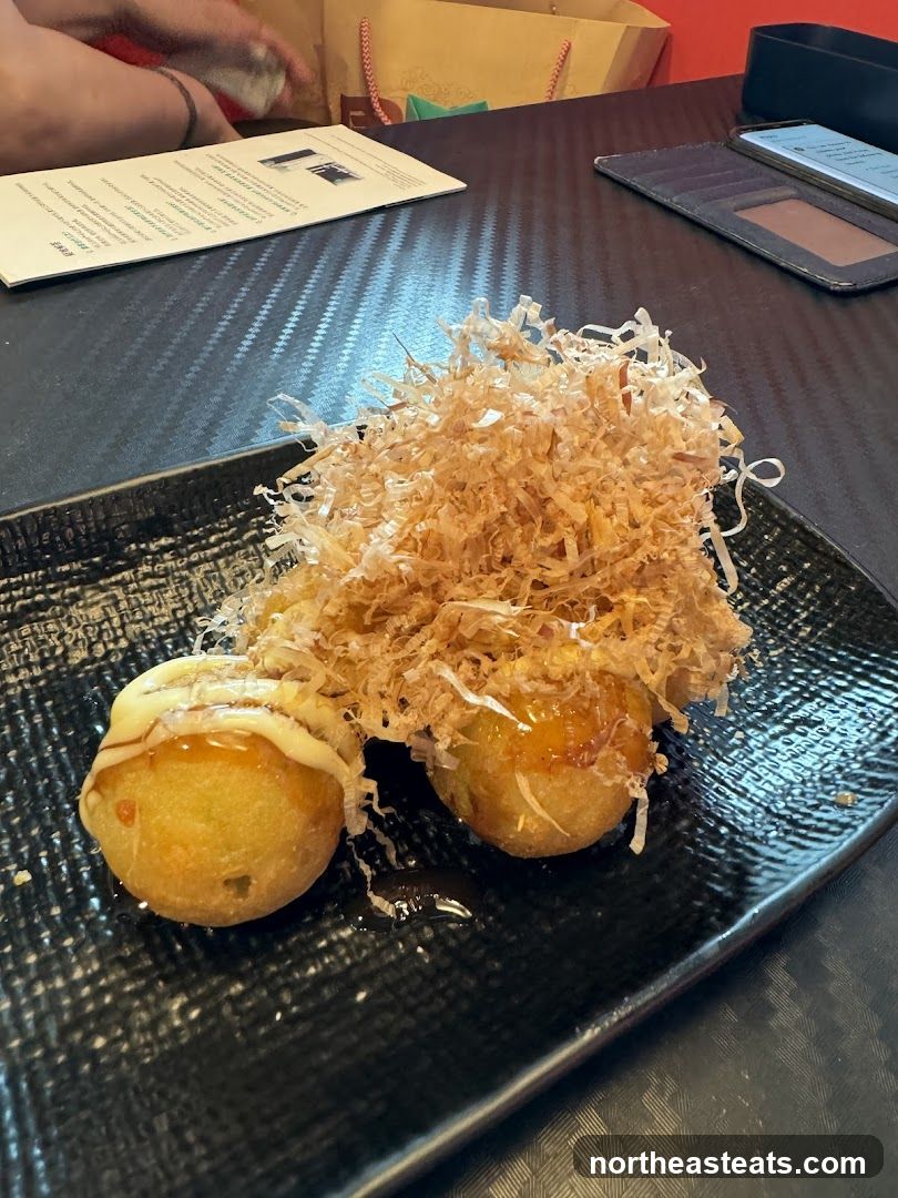 Takoyaki on a black plate