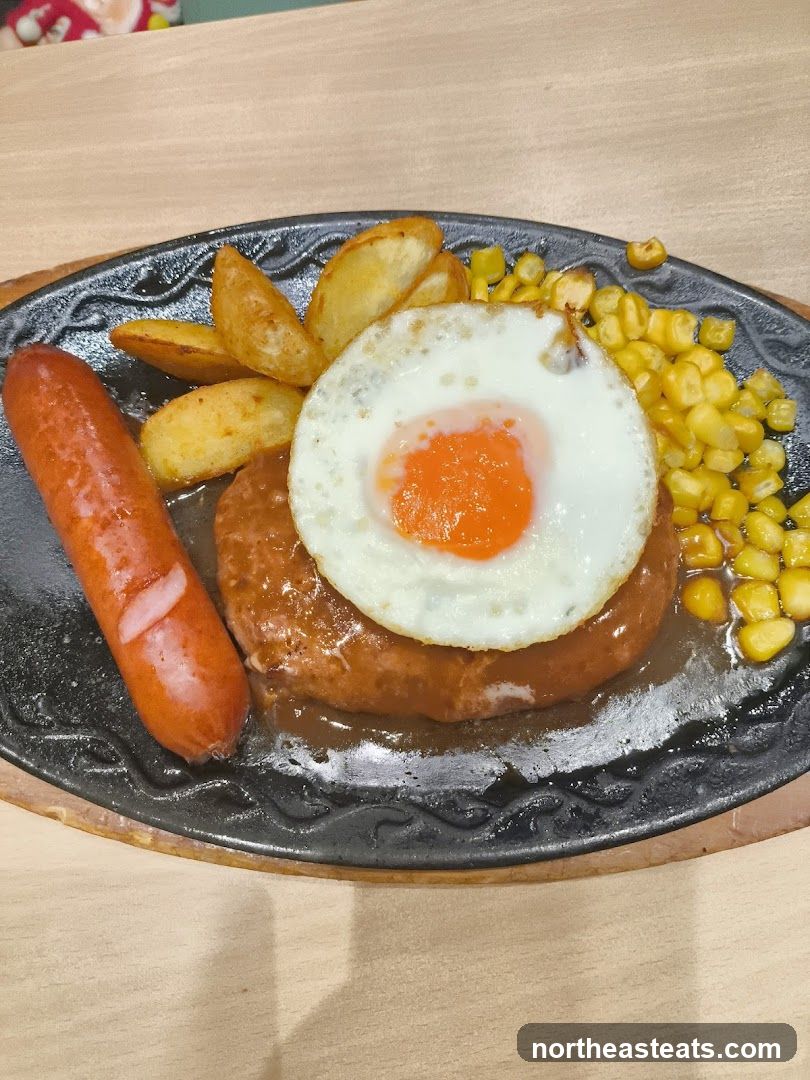 Sizzling Hamburger Steak with Fried Egg and Sausage