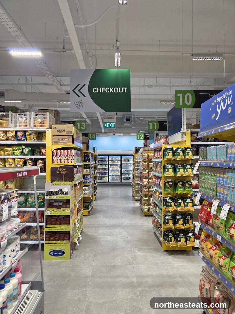 Supermarket aisle with checkout sign