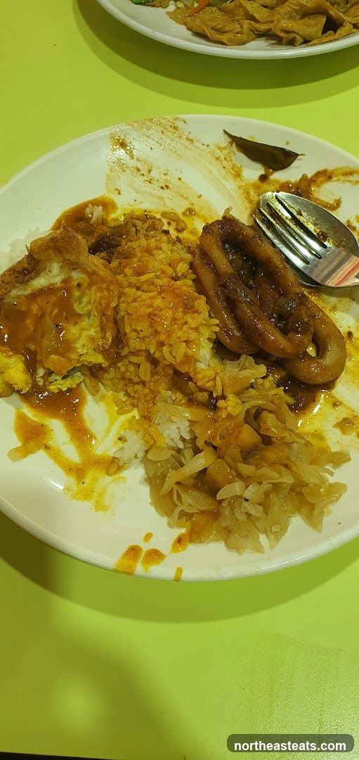 Partially Eaten Meal with Squid and Rice