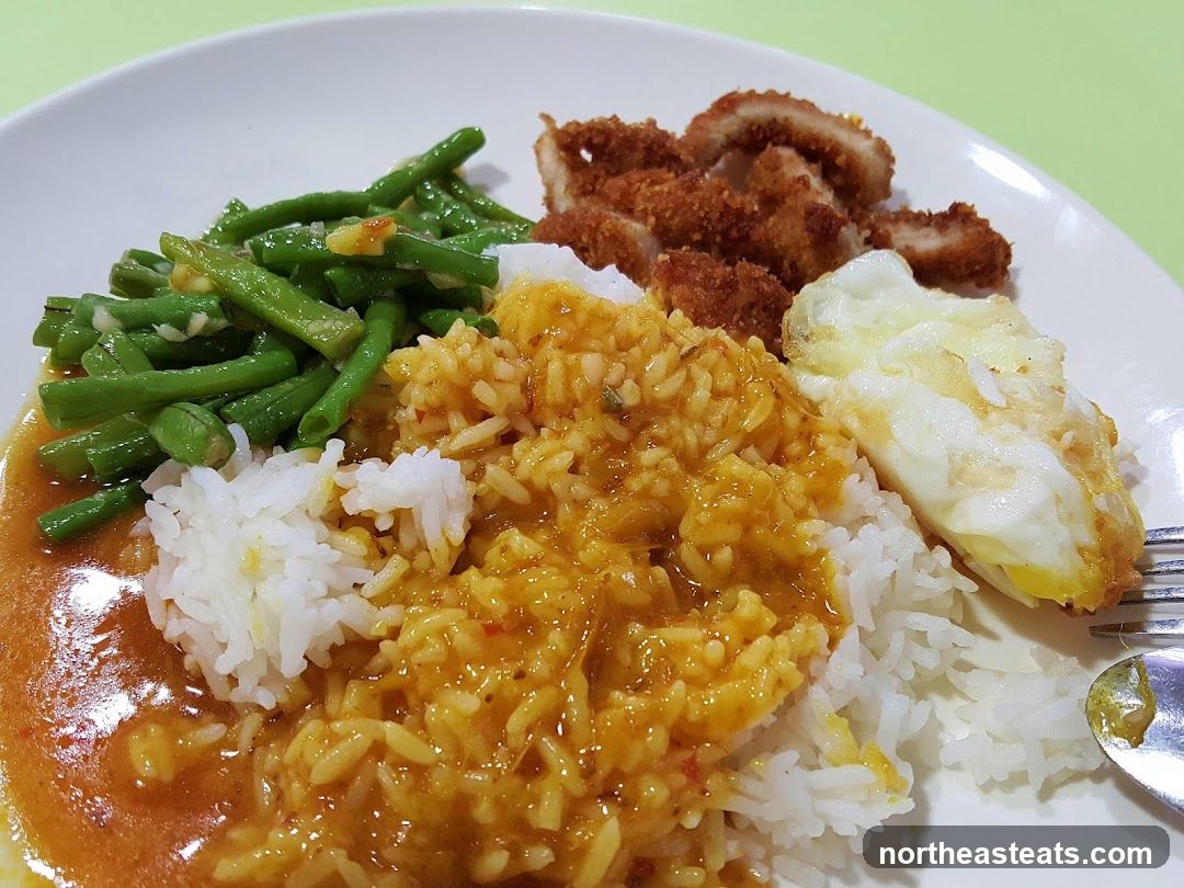 Rice plate with fried chicken, egg, and green beans