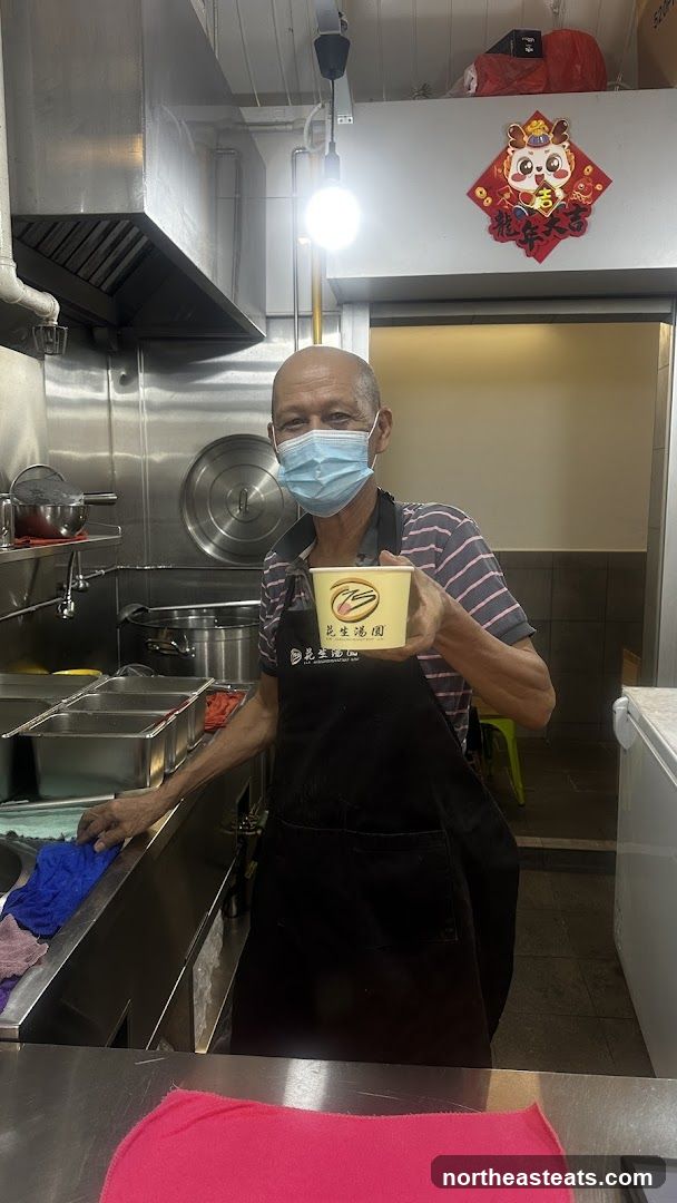Man holding a bowl of food